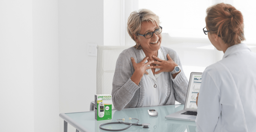 Doctor explaining Reflect and Reveal to female patient